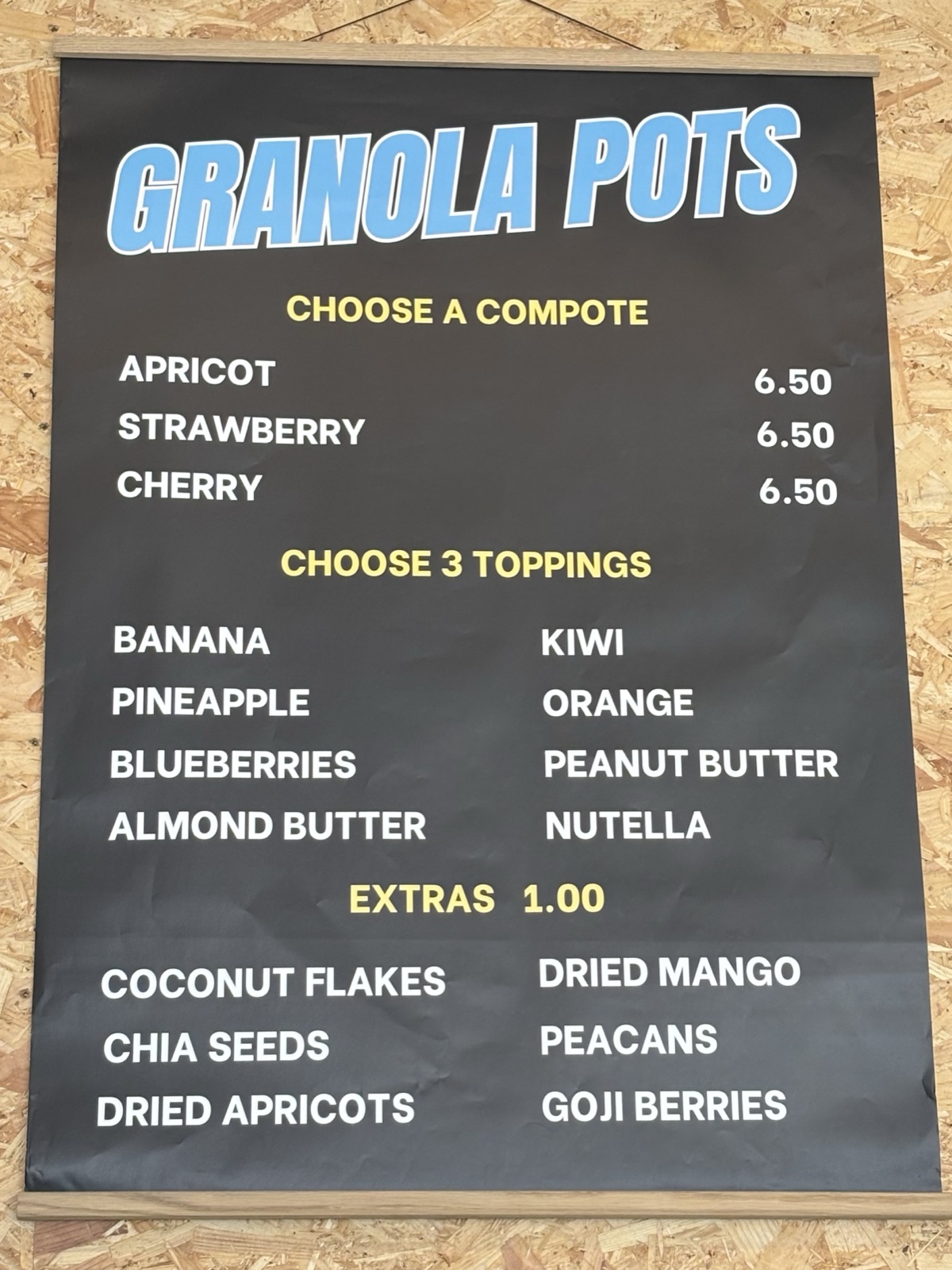 Granola pots menu board — choose a compote and three toppings, with extras